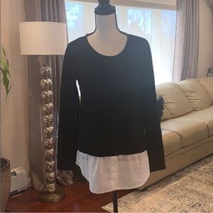 Black sweater with white formal shirt underneath